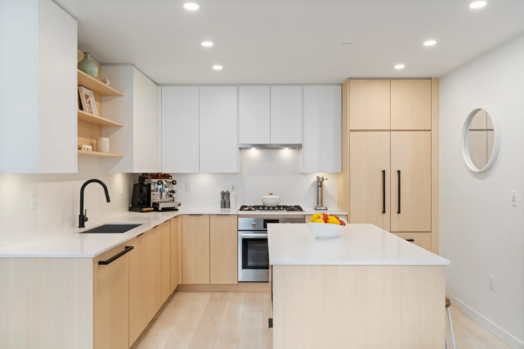 Kitchen with island, white oak cabinetry and open shelving